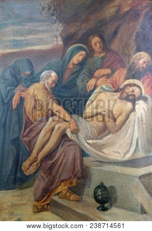 SISAK, CROATIA - DECEMBER 07: 14th Stations of the Cross, Jesus is laid in the tomb and covered in incense, Church of Visitation of the Virgin Mary in Sisak, Croatia, on December 07, 2017.