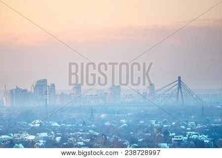 Panoramic View Of Sunset In The City With Cable-braced Bridge And Buildings