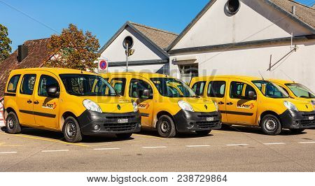 Andelfingen, Switzerland - 17 October, 2017: Parked Cars Of Swiss Post. Swiss Post Is The National P