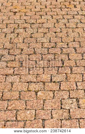 Pavement Of Gray Square Granite Tiles. Neat Square Pieces Of Red Granite In A Lined Path