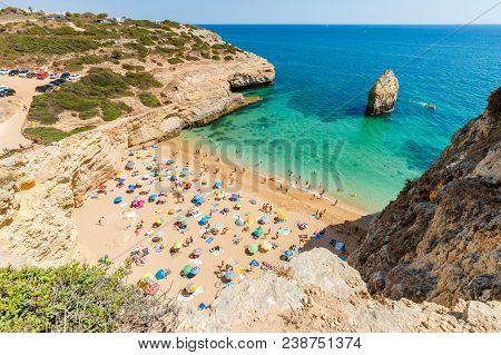 Lagoa, Portugal - August 31, 2017: People Enjoying Their Time Under Colorful Umbrellas On Carvalho B