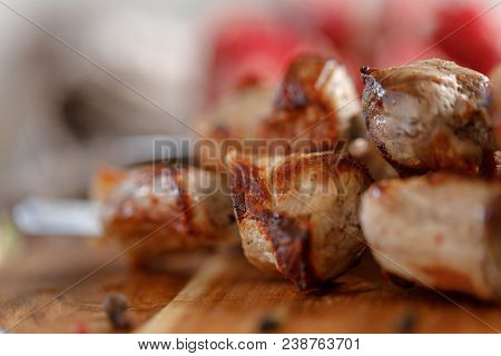 Shish Kebab From Pork Closeup. Juicy Meat Cooked On An Open Fire. Rustic.