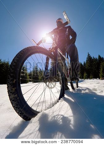 Wide View Photo Of Mountain Bike In Deep Snow. Winter Mountains With Road Lost Under Snow.