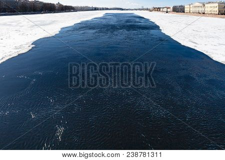 Dark Water In Polynya In Neva River Near The Palace Bridge In Saint Petersburg City In March