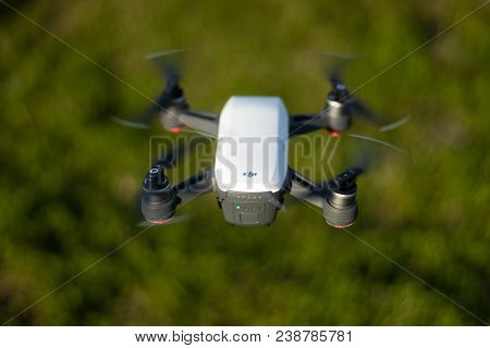 Seoul, South Korea - April 28, 2018: A Dji Spark Drone In Color Alpine White Mid-air Flying Over A G