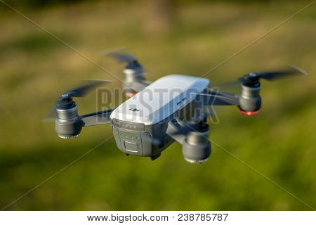 Seoul, South Korea - April 28, 2018: A Dji Spark Drone In Color Alpine White Mid-air Flying Over A G