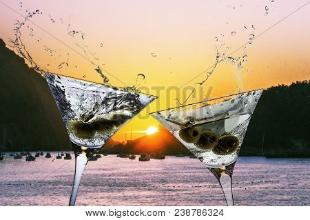 Cocktails With Splashining Martini On A Sunset Beach