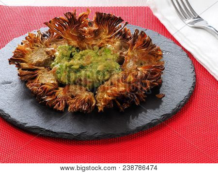 Fried Sliced Artichokes	 - Alcachofas Fritas

Artichoke Slices Deep Fried In Olive Oil. Tasty Vegan 