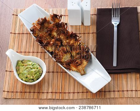 Fried Sliced Artichokes	 - Alcachofas Fritas

Artichoke Slices Deep Fried In Olive Oil. Tasty Vegan 