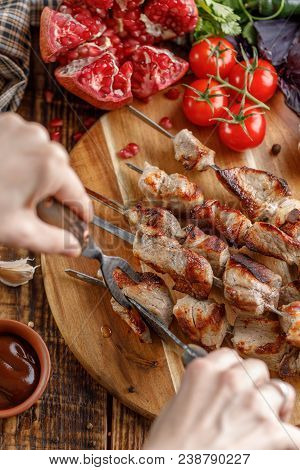 Rustic Still Life. Juicy Meat Cut With A Knife And Fork. Appetizing Shish Kebabs And Fresh Vegetable
