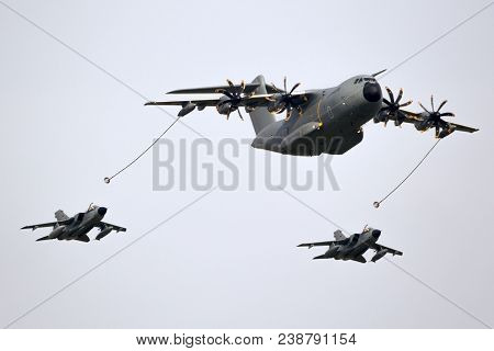 Berlin - Apr 27, 2018: German Air Force Airbus A400m Plane Aerial Refuelling Two Tornado Fighter Bom