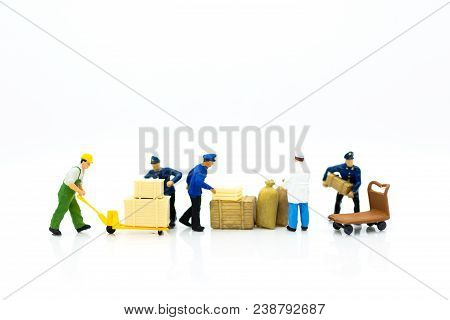 Miniature People: Workers Are Carrying Boxes For Transporting Goods To Destination. Image Use For Tr