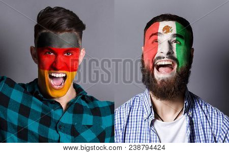 Emotional Soccer Fans With Painted Germany And Mexico Flags On Faces. Confrontation Of Football Team