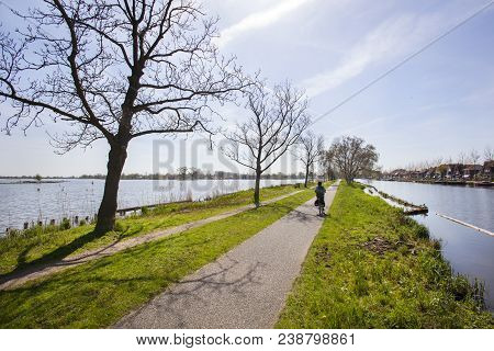 Bicycle Path And Footpath Through Water At The Reeuwijkse Plassen In The Netherlands