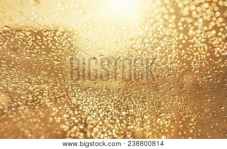 Droplets Of Rain On Car Wind Shield Reflection With Glow Sunlight In Morning Rainyday
