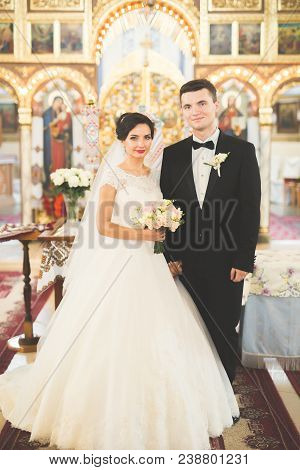 Wedding Couple Bide And Groom Get Married In A Church.