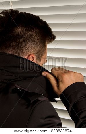 man with high collar