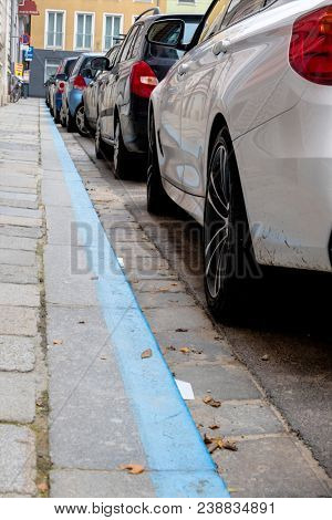 blue zone and parked cars
