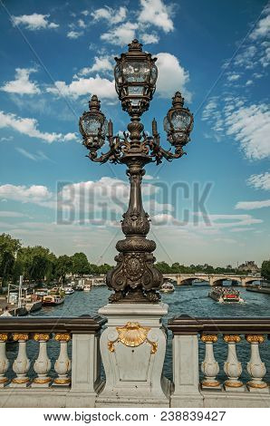 Close-up Of The The Lavishly Decorated Lamp On The Alexandre Iii Bridge At The Seine River In Paris.