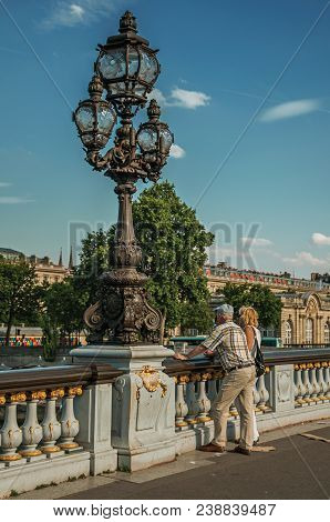Paris, France - July 07, 2017. People On Elegant Alexandre Iii Bridge Over The Seine River In Paris.