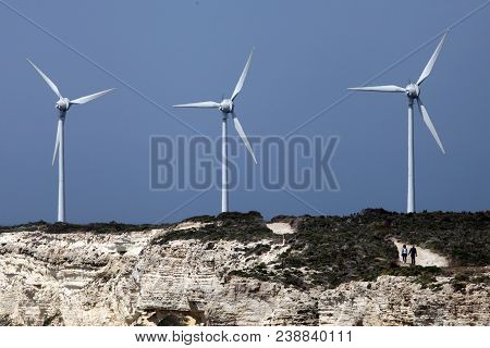 Tourists Are Walking Around Polente Hill Windmills