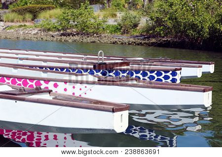 Dragon Boats Docked Up In The Water