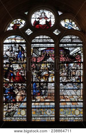 PARIS, FRANCE - JANUARY 04: Stained glass window in the church depicts The Parable of Those Invited to the Wedding Feast, Saint Etienne du Mont Church, Paris, France on January 04, 2018.