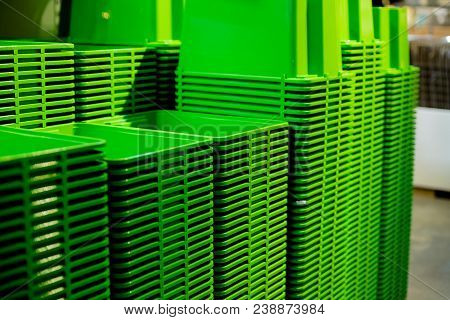 A Stack Of Recycled Plastic Buckets On Display At A Sundry Store.bowls On The Shelf In The Store.