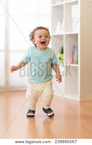 Little Baby Boy Running And Laughing In Ther Living Room