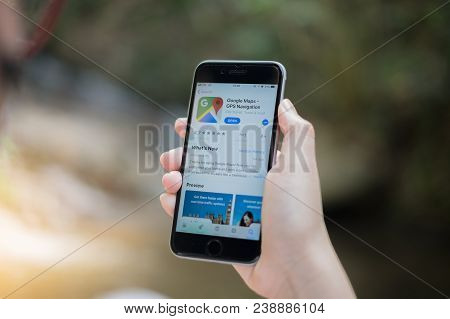 Chiang Mai, Thailand - Mar 01, 2018: A Man Hand Holding Screen Shot Of Google Maps App Showing On Ip