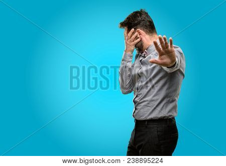 Middle age man, with beard and bow tie stressful and shy keeping hand on head, tired and frustrated