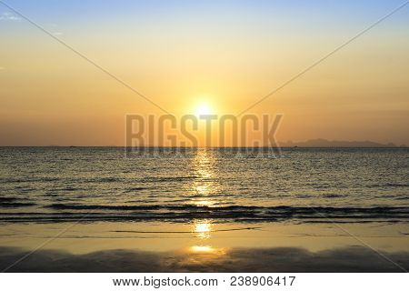 Beautiful Sunset Over Sea And Tropical Beach In Summer Time. Natural Background Of Sunset Dawn And S