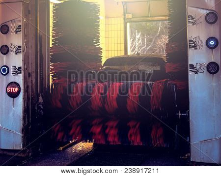 Automatic Brush Car Wash In Prozess, Red And Black Brushes