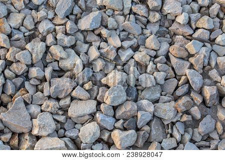 Flat Macadam Closeup Background With Pair Of Small Dry Sticks