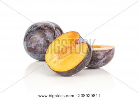 Halved Red Blue Plum And One Whole Isolated On White Background Two Halves
