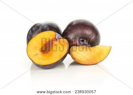 Two Red Blue Plums One Half And A Slice Isolated On White Background