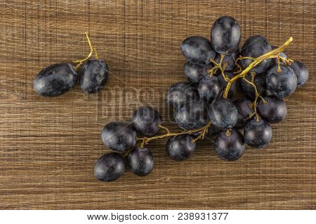 Black Grape Cluster (autumn Royal Variety) With Berries Table Top Isolated On Black Wood Background