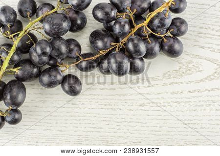 Black Grapes Cluster (autumn Royal Variety) Table Top Isolated On Grey Wood Background