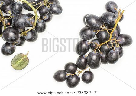 Black Grape Clusters (autumn Royal Variety) With One Halved Berry Top View Isolated On White Backgro