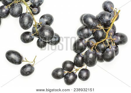 Black Grape Clusters (autumn Royal Variety) With Two Purple Berries Top View Isolated On White Backg