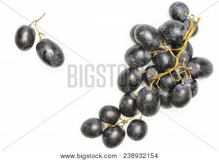 Black Grape Cluster (autumn Royal Variety) With Two Purple Berries Top View Isolated On White Backgr