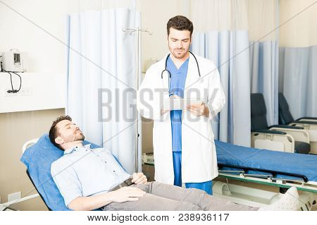 Doctor Updating Patient's Medical Records
