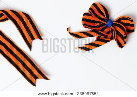 Bant Of Black And Orange Ribbons Of St. George Isolated On White Background