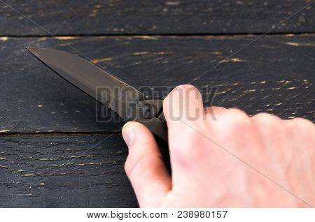 The Knife Is Compressed In The Hand.