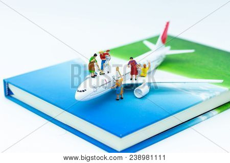 Miniature People: Group Worker Are Repairing The Plane. Image Use For Maintenance, Improvement, Busi