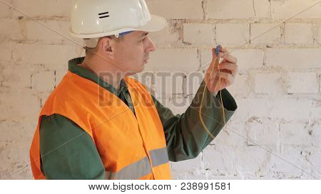 The Telecommunications Engineer Works With A Cable To Transfer Internet Data
