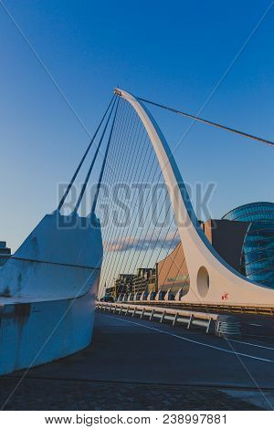 View Of Dublin's Famous Samuel Beckett Bridge Over The River Liffey At Blue Hour