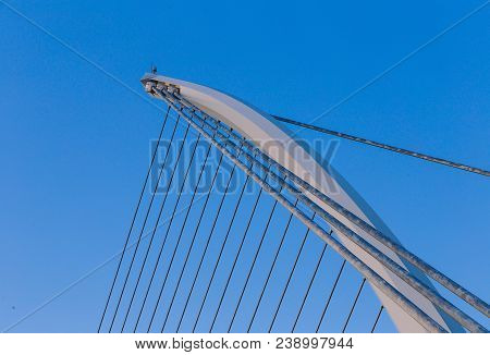 View Of Dublin's Famous Samuel Beckett Bridge Over The River Liffey At Blue Hour