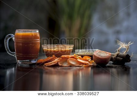 Freshly Sliced Carrots On The Wooden Surface Along With Its Juice And Face Mask Consisting Of Some H