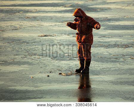 Lipetsk, Russia - December 6, 2019: A Man Catches Fish On Ice In The Morning At The Matyr Reservoir.